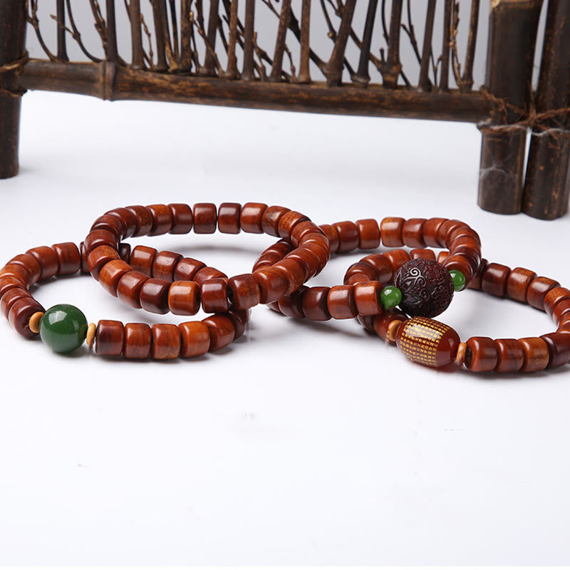 Bracelet de force en agate rouge et corne de mouton avec Buddha Stones d'os tibétaines et perles dzi à trois yeux