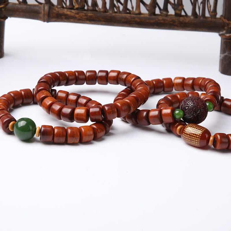 Bracelet de force en agate rouge et corne de mouton avec Buddha Stones d'os tibétaines et perles dzi à trois yeux