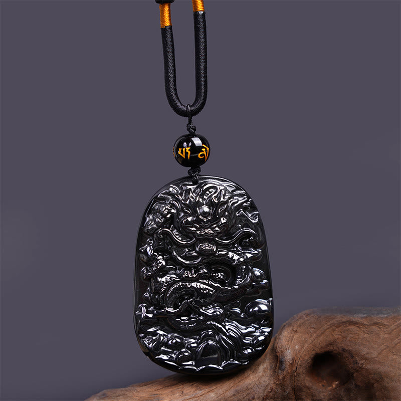 Collier pendentif de protection de la chance sculpté en obsidienne noire avec des Buddha Stones - Dragon ovale 58 mm x 41 mm - image 1