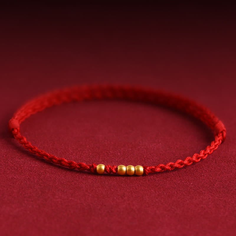 Bracelet de couple tressé avec Buddha Stones - Cordon rouge (une et trois perles dorées) - 24 cm - image 0