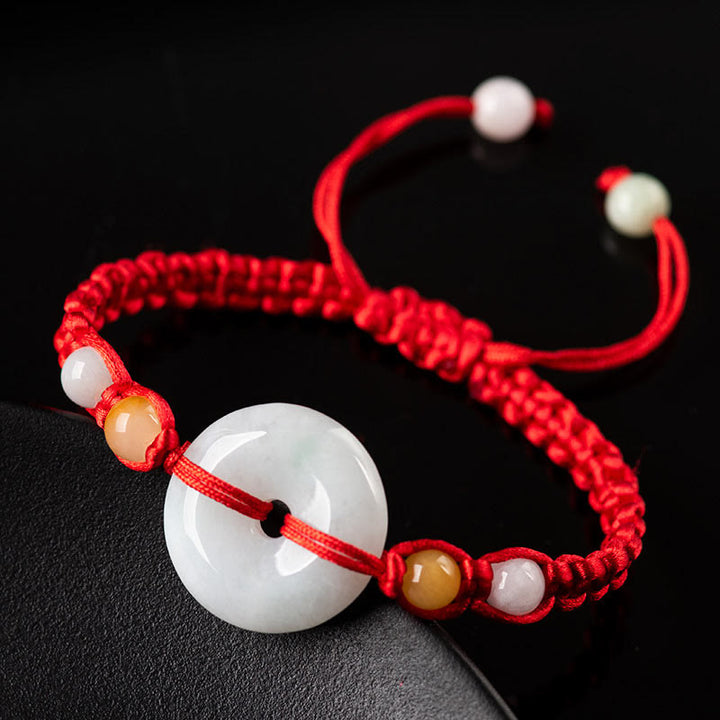 Bracelet en fil rouge avec boucle de paix en jade et Buddha Stones