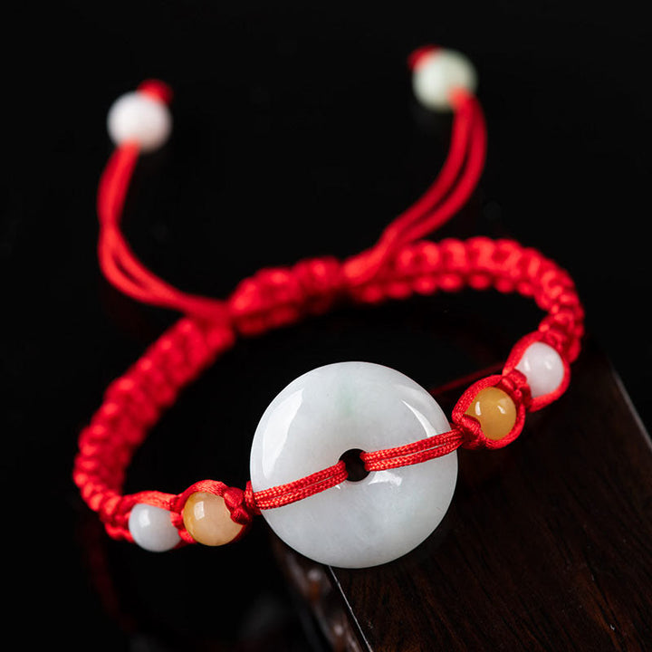 Bracelet en fil rouge avec boucle de paix en jade et Buddha Stones