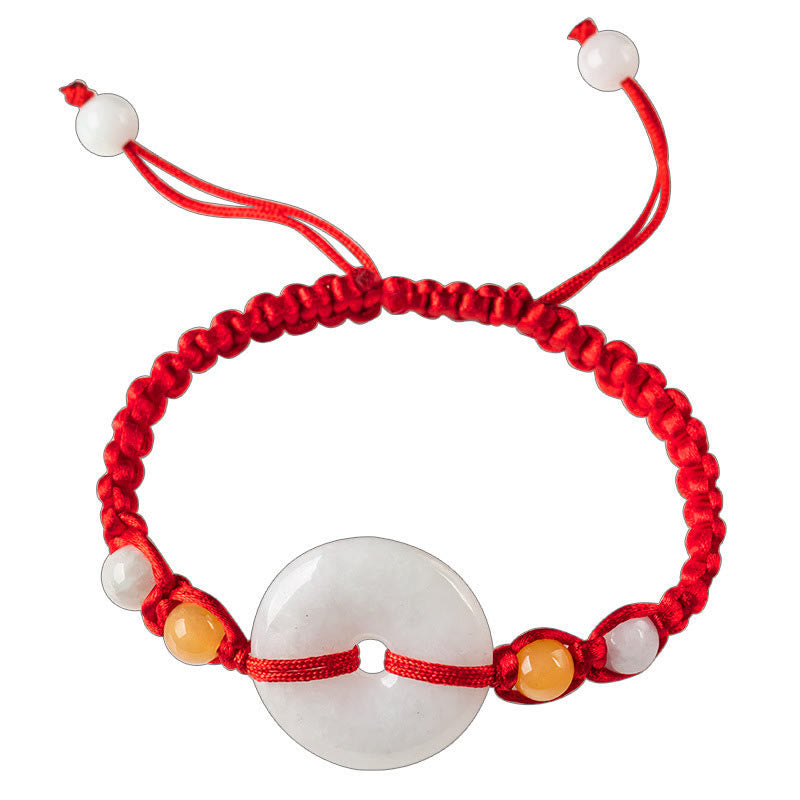 Bracelet en fil rouge avec boucle de paix en jade et Buddha Stones