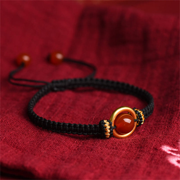 Bracelet en corde calme avec boucle de paix et perles d'agate rouge en Buddha Stones