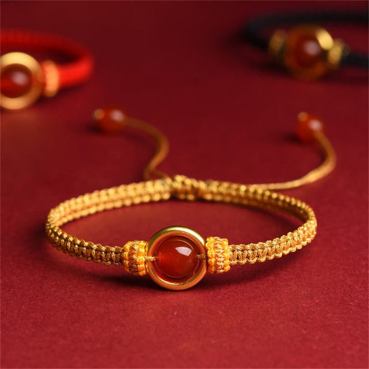 Bracelet en corde calme avec boucle de paix et perles d'agate rouge en Buddha Stones