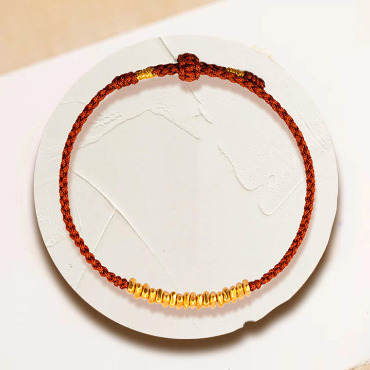 Bracelet en corde tressée de protection fait main en petites pièces d'or 999 Buddha Stones