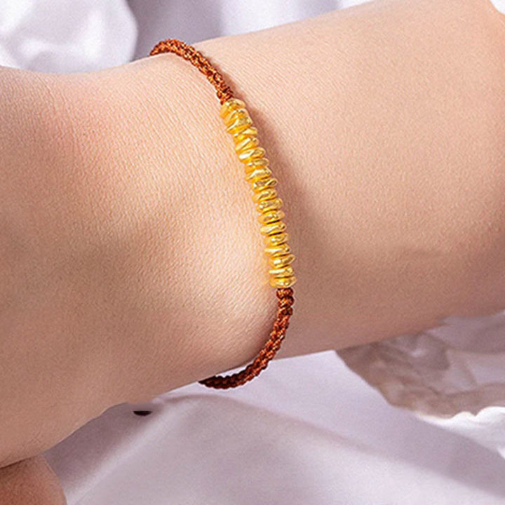 Bracelet en corde tressée de protection fait main en petites pièces d'or 999 Buddha Stones