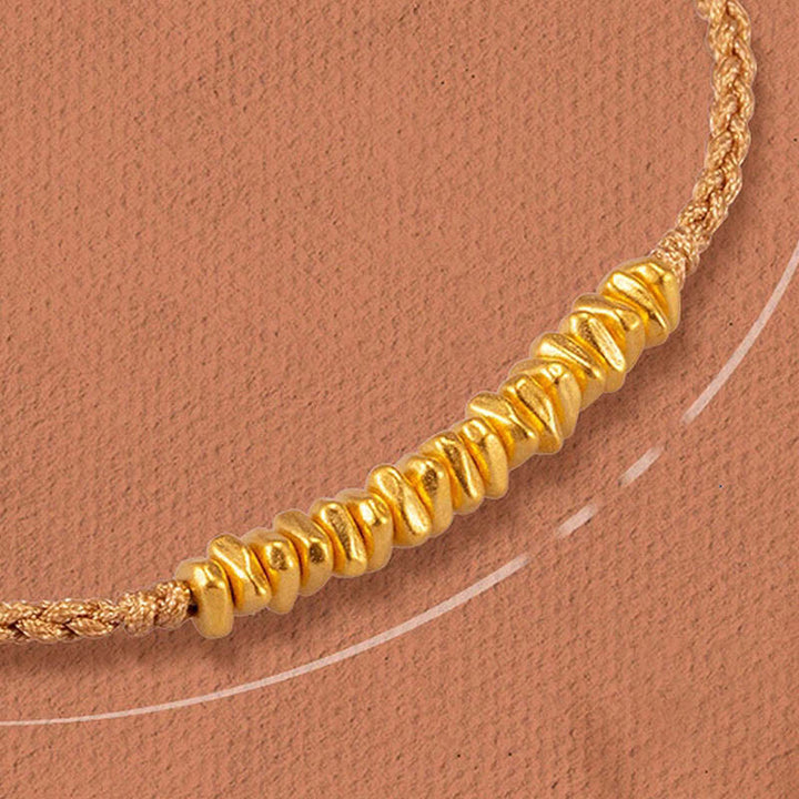 Bracelet en corde tressée de protection fait main en petites pièces d'or 999 Buddha Stones