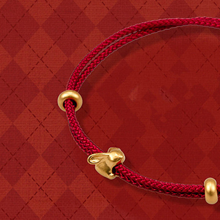 Bracelet en corde tressée fait main avec petit lapin porte-bonheur en or 999 de Buddha Stones