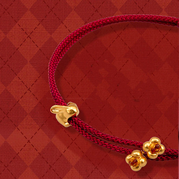 Bracelet en corde tressée fait main avec petit lapin porte-bonheur en or 999 de Buddha Stones
