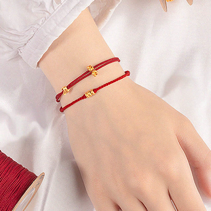 Bracelet en corde tressée fait main avec petit lapin porte-bonheur en or 999 de Buddha Stones