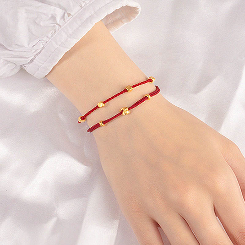 Bracelet en corde tressée fait main avec petit lapin porte-bonheur en or 999 de Buddha Stones