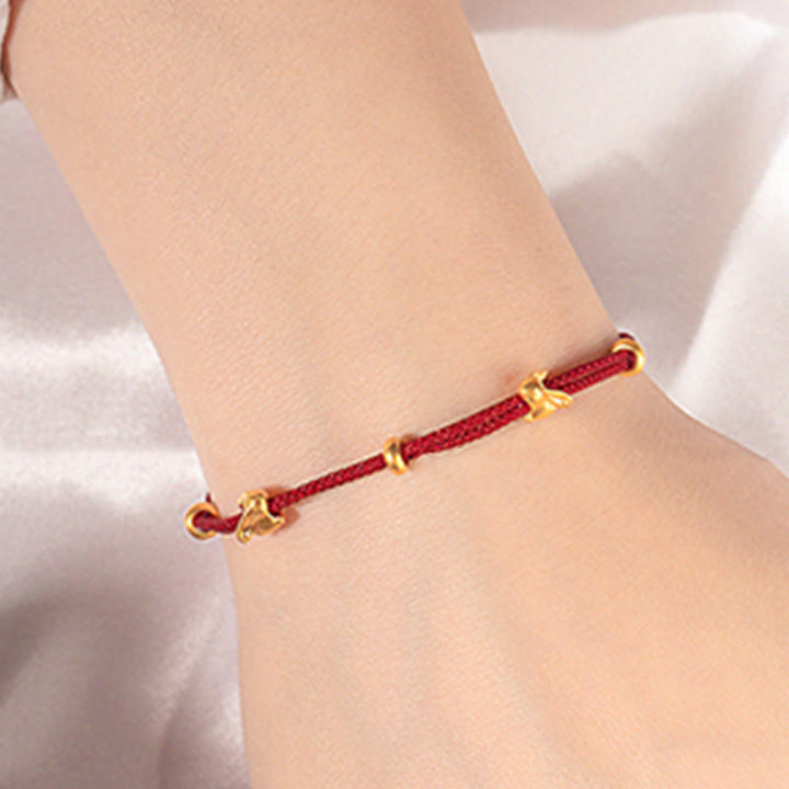 Bracelet en corde tressée fait main avec petit lapin porte-bonheur en or 999 de Buddha Stones