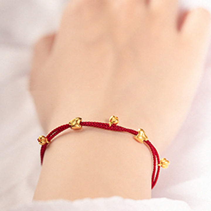 Bracelet en corde tressée fait main avec petit lapin porte-bonheur en or 999 de Buddha Stones