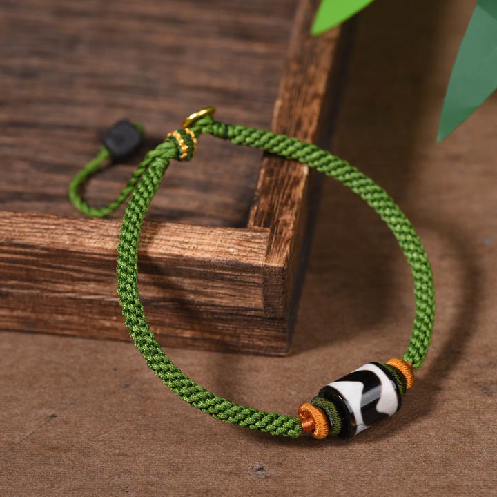 Bracelet de protection en corde verte tressée en perles dzi tibétaines faites à la main avec Buddha Stones