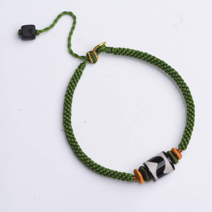 Bracelet de protection en corde verte tressée en perles dzi tibétaines faites à la main avec Buddha Stones