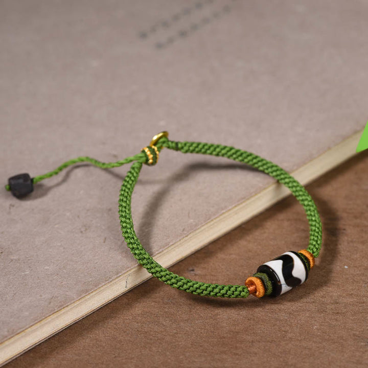 Bracelet de protection en corde verte tressée en perles dzi tibétaines faites à la main avec Buddha Stones
