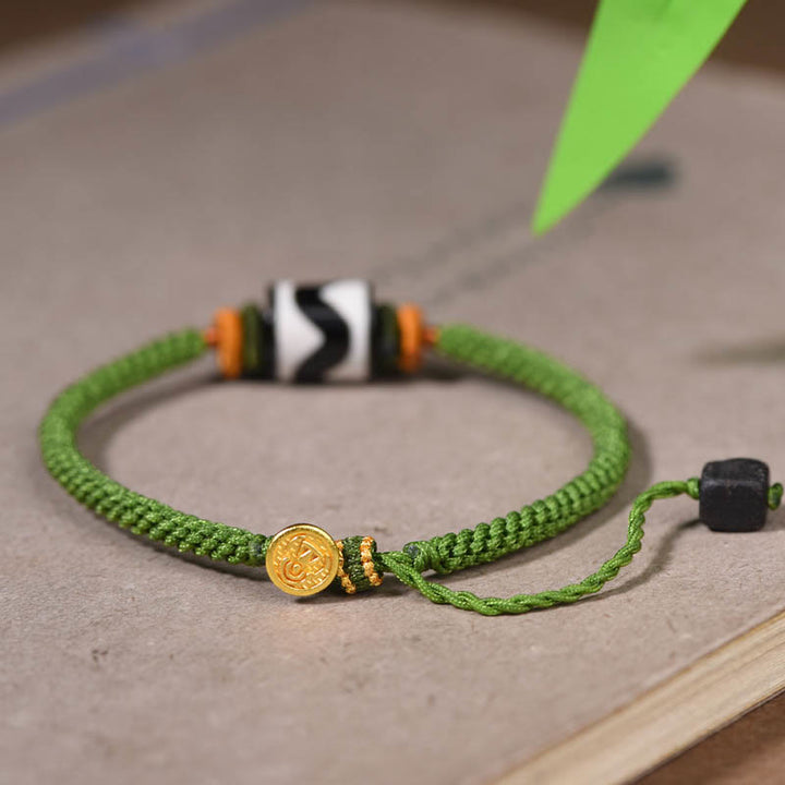 Bracelet de protection en corde verte tressée en perles dzi tibétaines faites à la main avec Buddha Stones