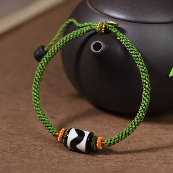 Bracelet de protection en corde verte tressée en perles dzi tibétaines faites à la main avec Buddha Stones