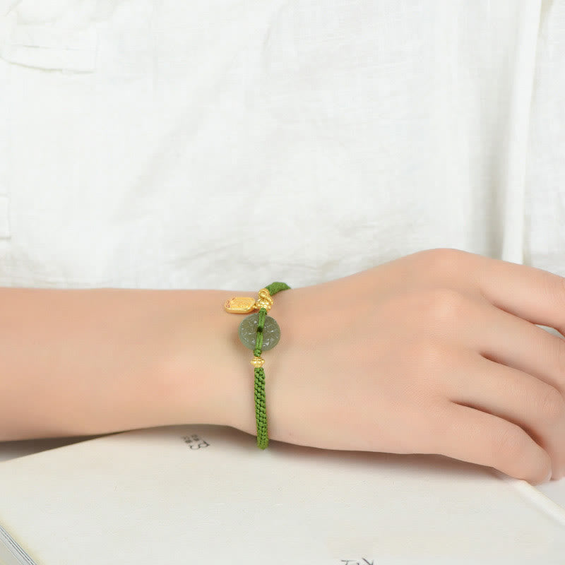 Bracelet en corde verte avec boucle de paix en jade vert et Buddha Stones
