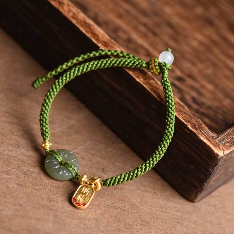 Bracelet en corde verte avec boucle de paix en jade vert et Buddha Stones