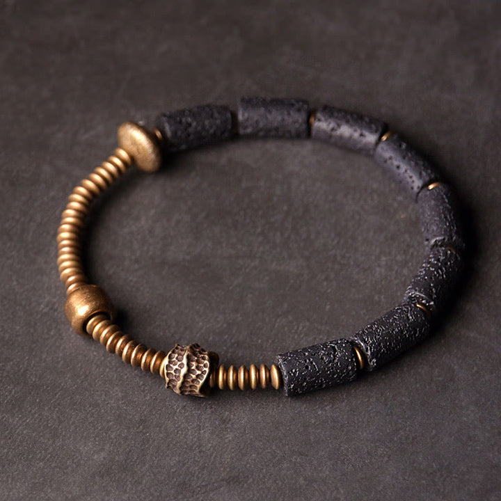 Bracelet en cuivre avec perles de lave noires et Buddha Stones