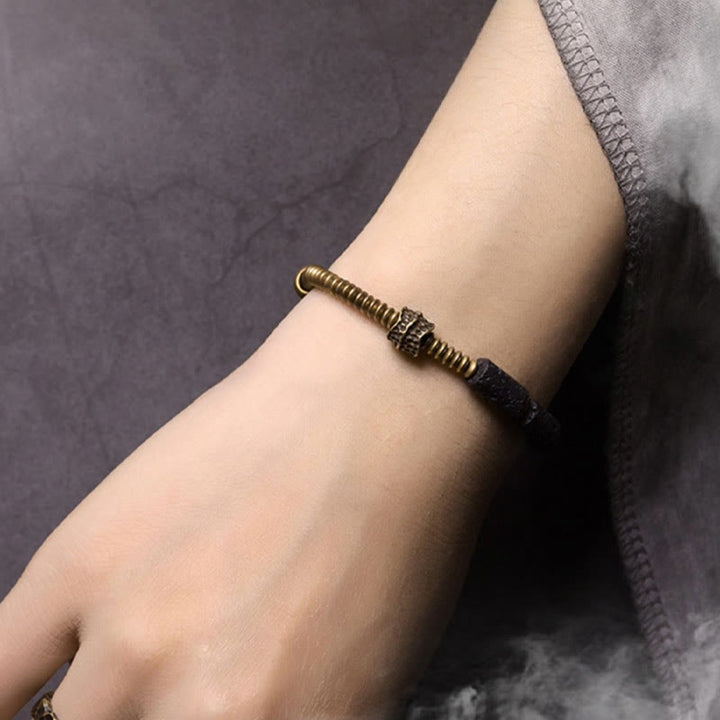Bracelet en cuivre avec perles de lave noires et Buddha Stones