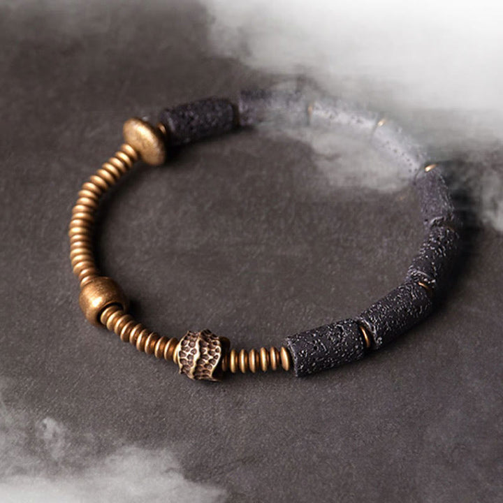Bracelet en cuivre avec perles de lave noires et Buddha Stones