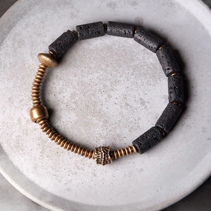 Bracelet en cuivre avec perles de lave noires et Buddha Stones