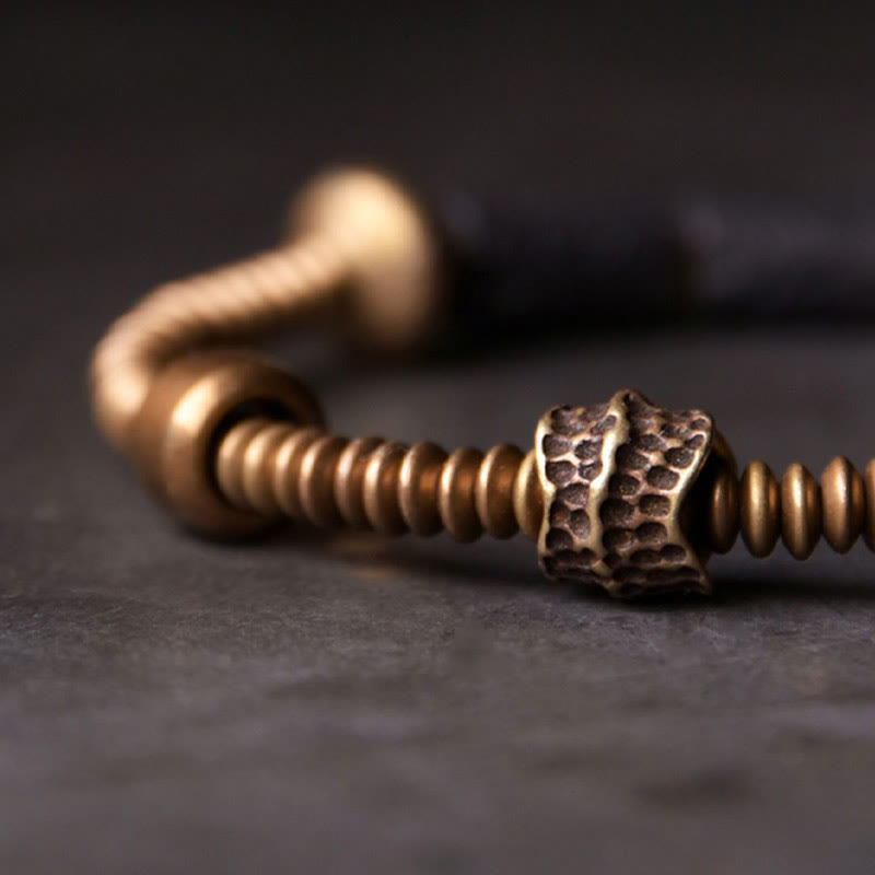 Bracelet en cuivre avec perles de lave noires et Buddha Stones