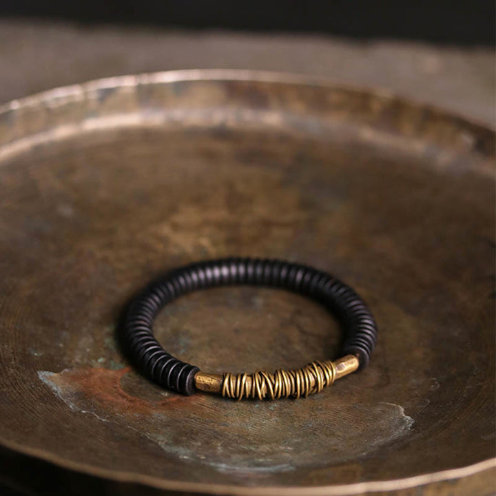 Bracelet en cuivre et bois d'ébène tibétain calme avec Buddha Stones