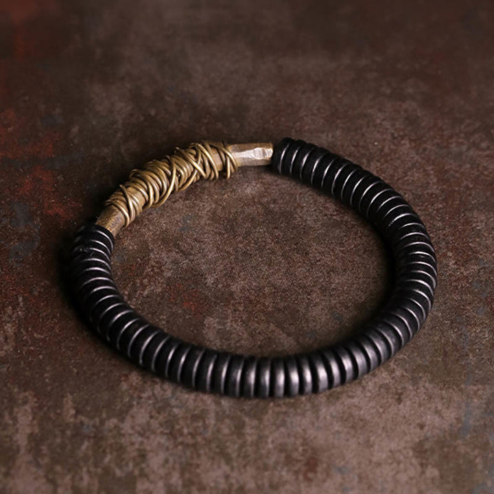 Bracelet en cuivre et bois d'ébène tibétain calme avec Buddha Stones