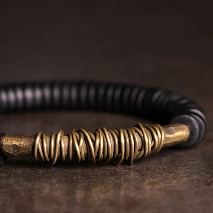 Bracelet en cuivre et bois d'ébène tibétain calme avec Buddha Stones