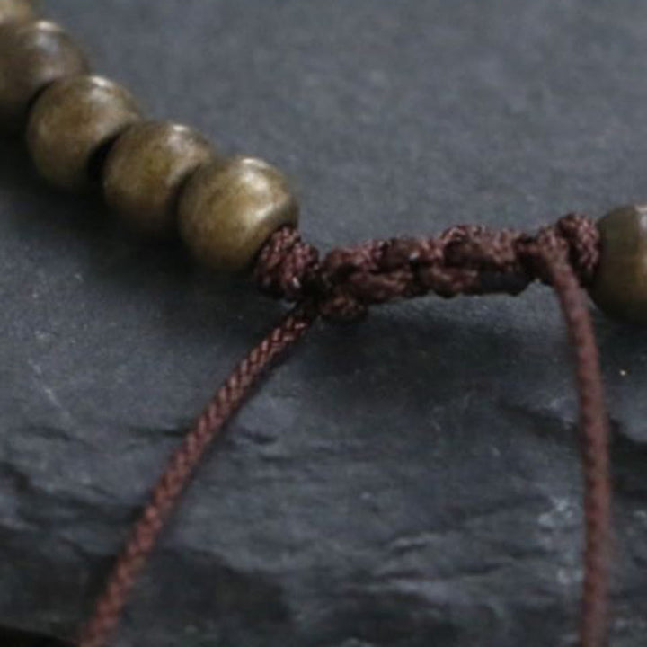 Bracelet simple en perles de cuivre et de laiton avec Buddha Stones