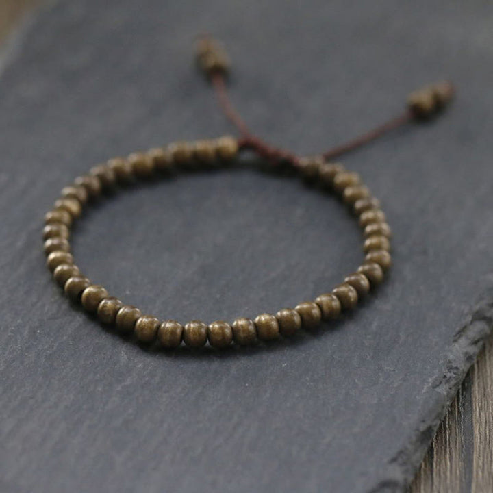 Bracelet simple en perles de cuivre et de laiton avec Buddha Stones
