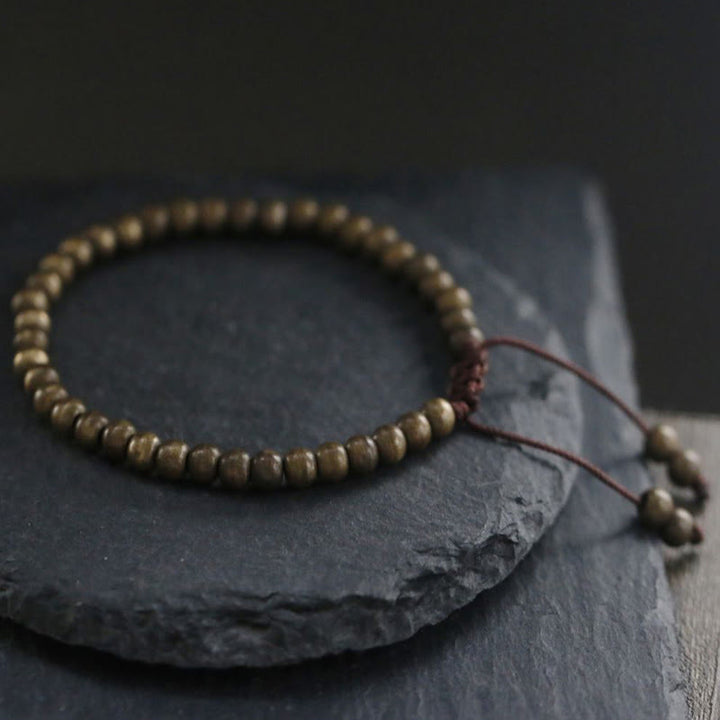 Bracelet simple en perles de cuivre et de laiton avec Buddha Stones