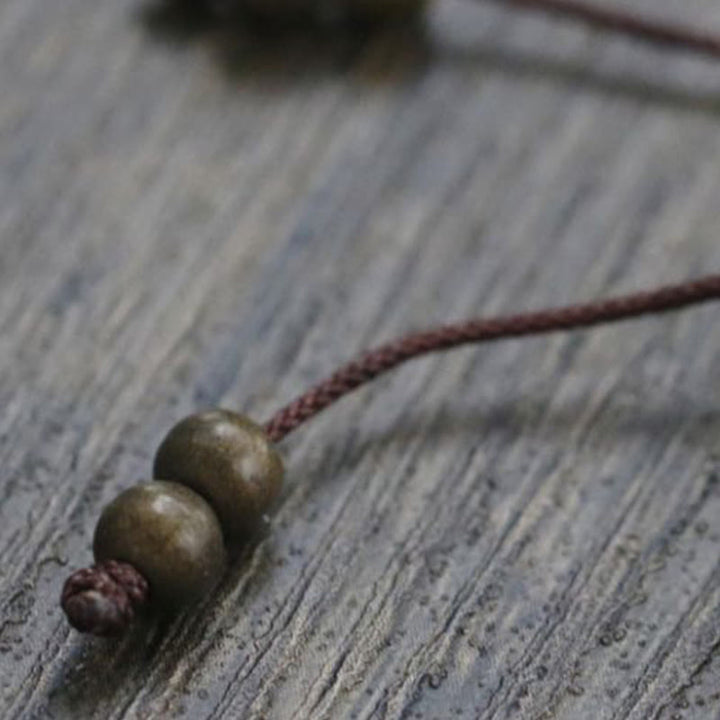 Bracelet simple en perles de cuivre et de laiton avec Buddha Stones