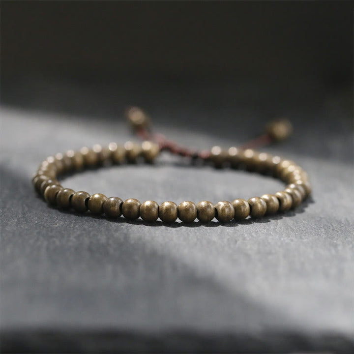 Bracelet simple en perles de cuivre et de laiton avec Buddha Stones