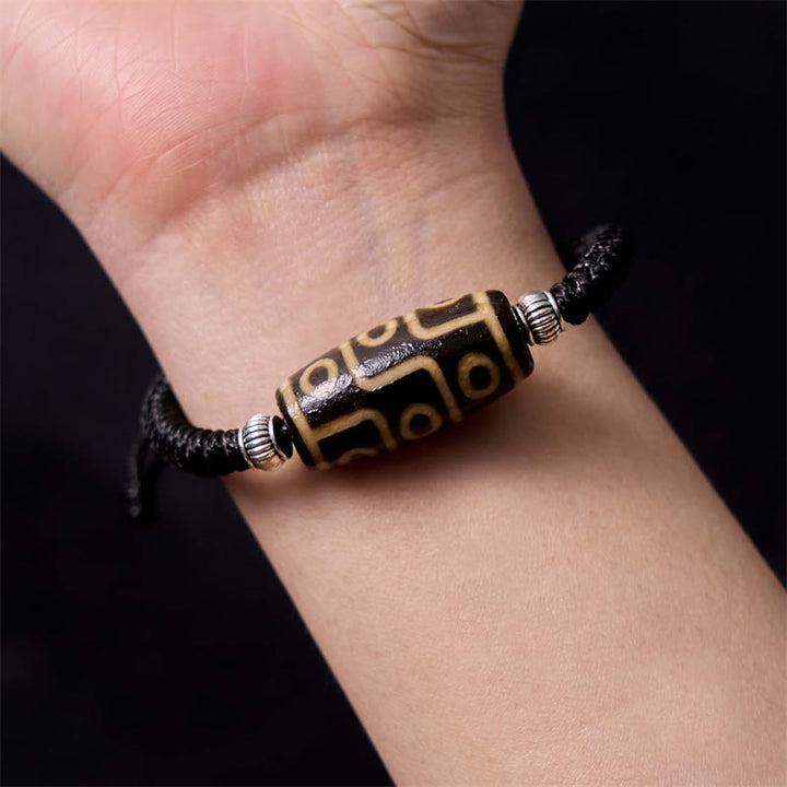 Bracelet en corde de protection de richesse Buddha Stones tibétaines à neuf yeux et à trois yeux