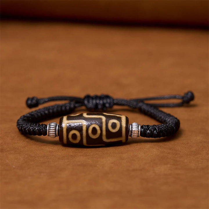 Bracelet en corde de protection de richesse Buddha Stones tibétaines à neuf yeux et à trois yeux
