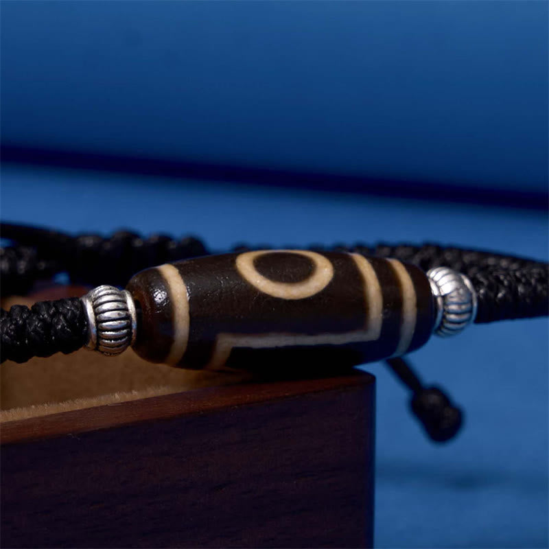 Bracelet en corde de protection de richesse Buddha Stones tibétaines à neuf yeux et à trois yeux