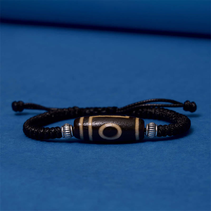 Bracelet en corde de protection de richesse Buddha Stones tibétaines à neuf yeux et à trois yeux