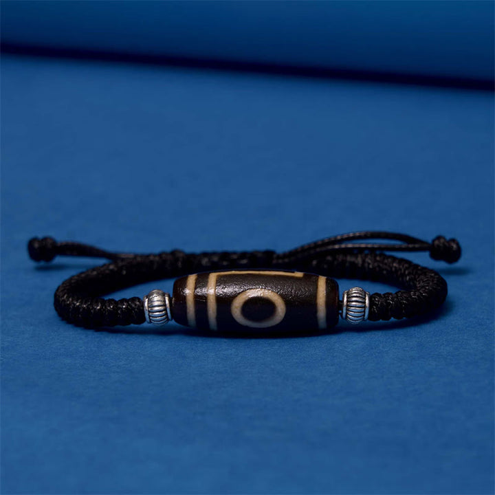 Bracelet en corde de protection de richesse Buddha Stones tibétaines à neuf yeux et à trois yeux