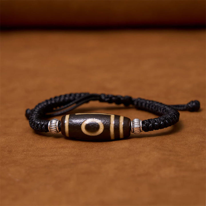 Bracelet en corde de protection de richesse Buddha Stones tibétaines à neuf yeux et à trois yeux