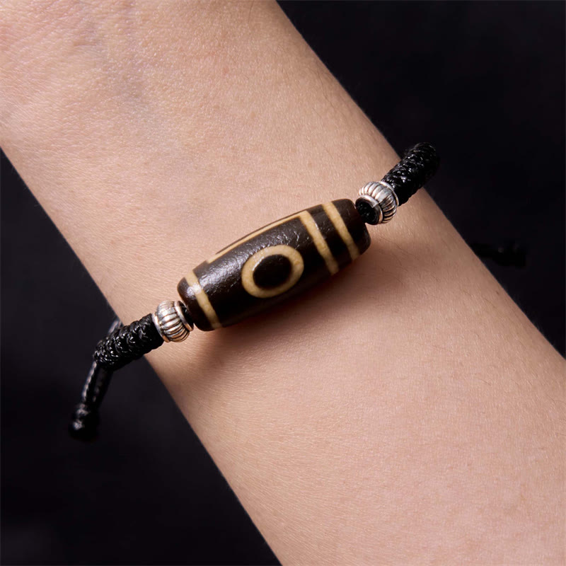 Bracelet en corde de protection de richesse Buddha Stones tibétaines à neuf yeux et à trois yeux
