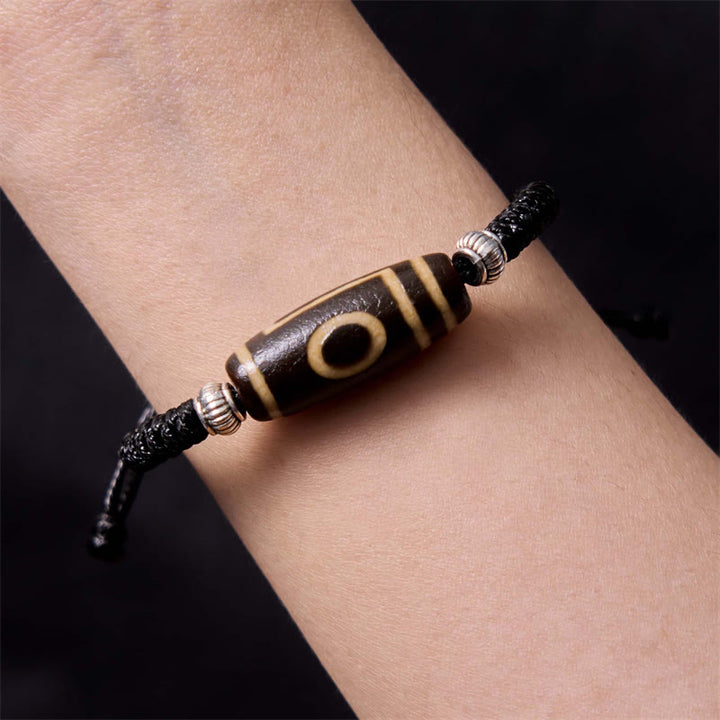 Bracelet en corde de protection de richesse Buddha Stones tibétaines à neuf yeux et à trois yeux