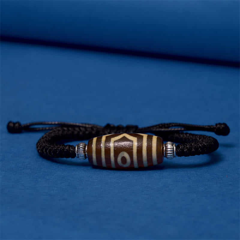 Bracelet en corde de protection de richesse Buddha Stones tibétaines à neuf yeux et à trois yeux