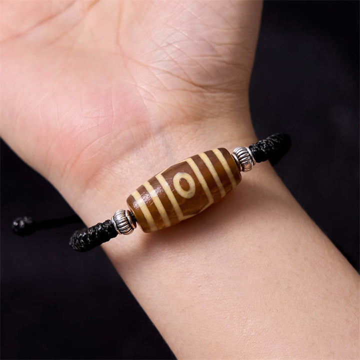 Bracelet en corde de protection de richesse Buddha Stones tibétaines à neuf yeux et à trois yeux