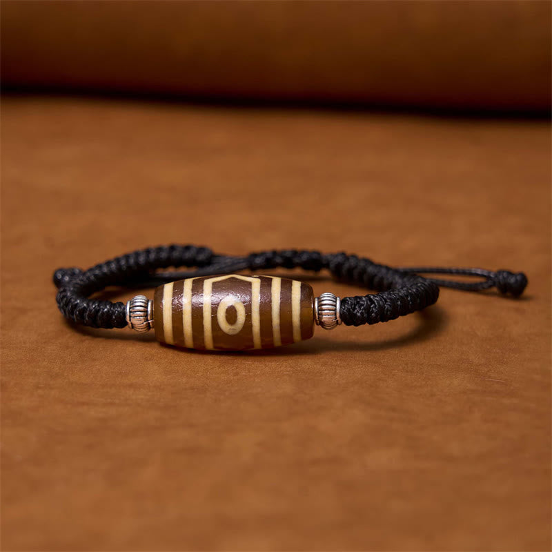 Bracelet en corde de protection de richesse Buddha Stones tibétaines à neuf yeux et à trois yeux