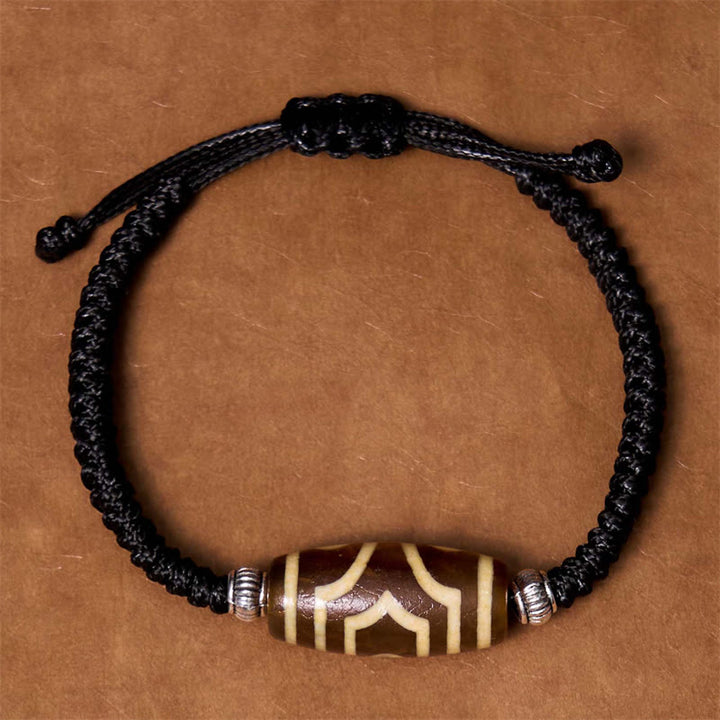 Bracelet en corde de protection de richesse Buddha Stones tibétaines à neuf yeux et à trois yeux